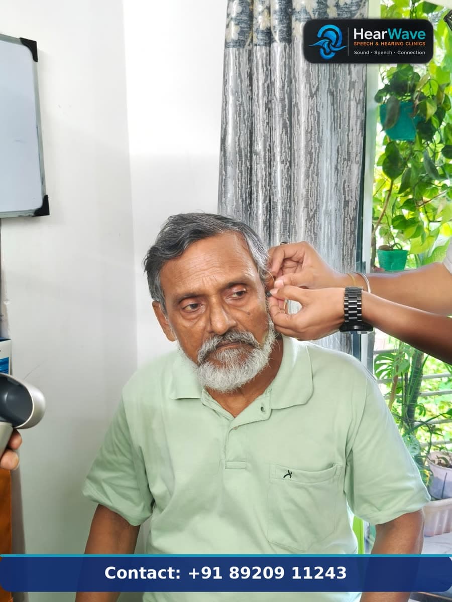 Hearwave audiologist fitting a hearing aid for a patient in Kolkata